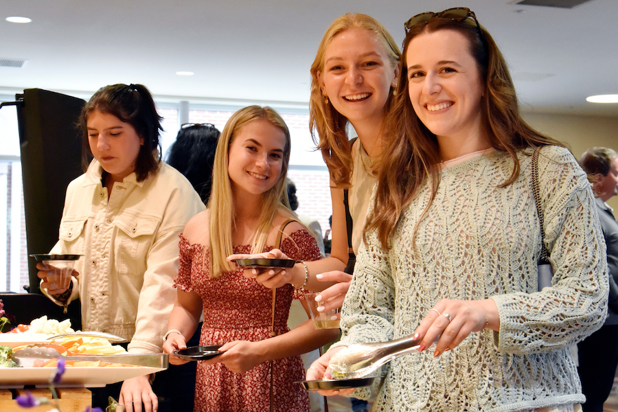 students in a buffet line